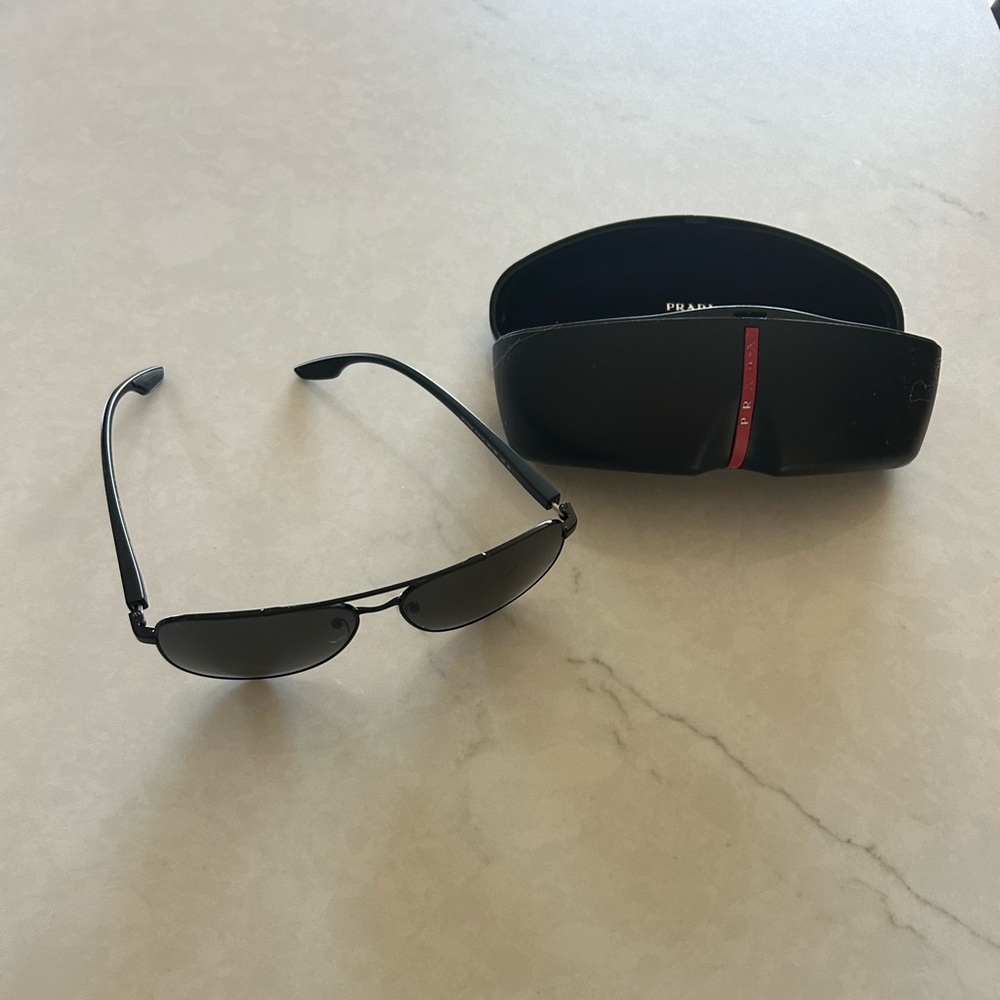 Prada Aviator Sunglasses. Black frames